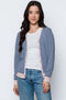 Woman wearing a striped cardigan, on a white background