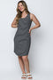 Woman wearing a black and white striped dress on a white background