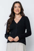 Woman wearing a black cardigan against a white background